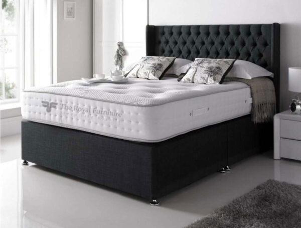 Wingback divan bed frame with tall upholstered headboard and storage options